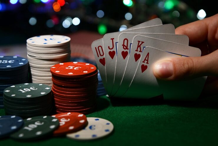 Live baccarat dealer at menangbet88 alternatif studio with shoe and cards